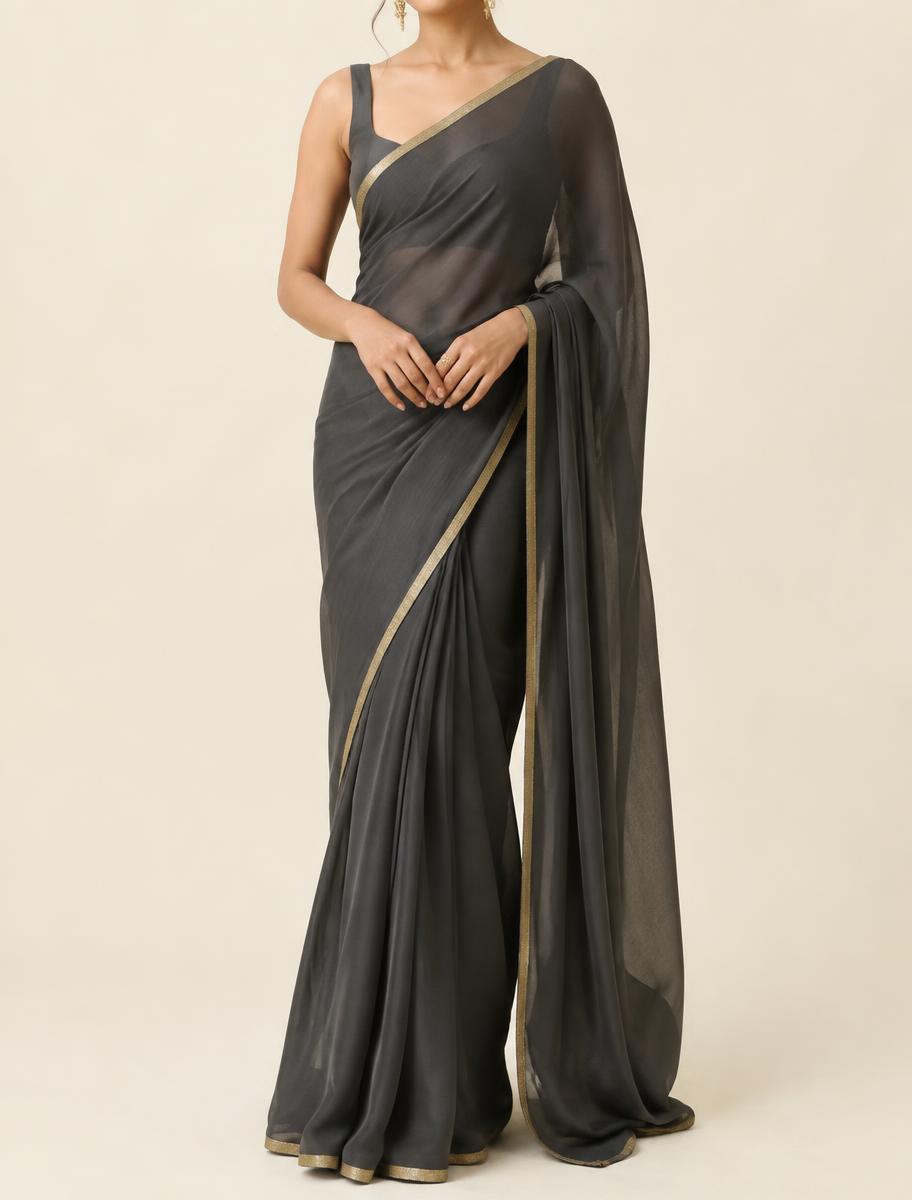 Charcoal georgette saree with a narrow antique gold edging