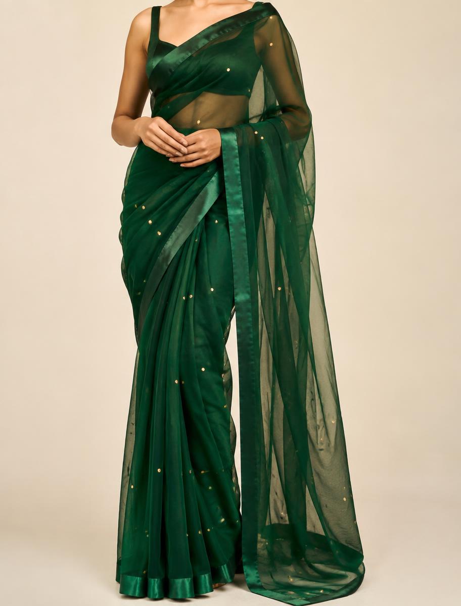 Emerald organza saree with scattered gold sequins and satin border